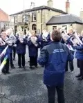 Carol saves Brass Band from second soaking!